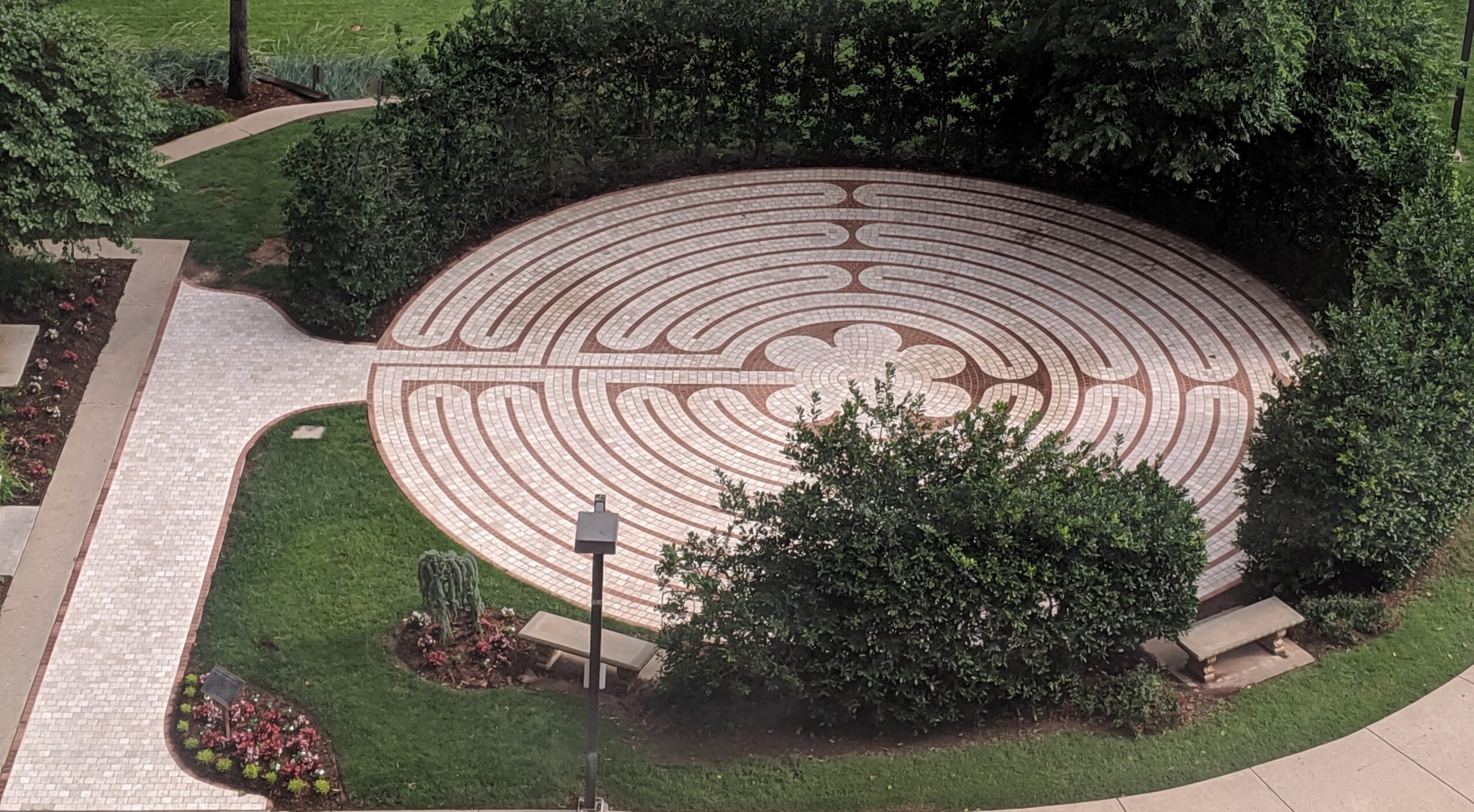 A stone labyrinth path in a quiet garden