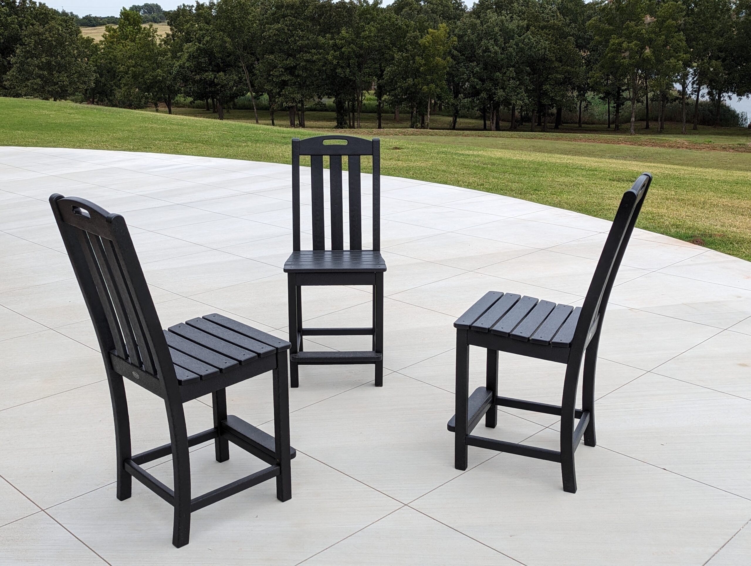 Three empty chairs arranged for conversation